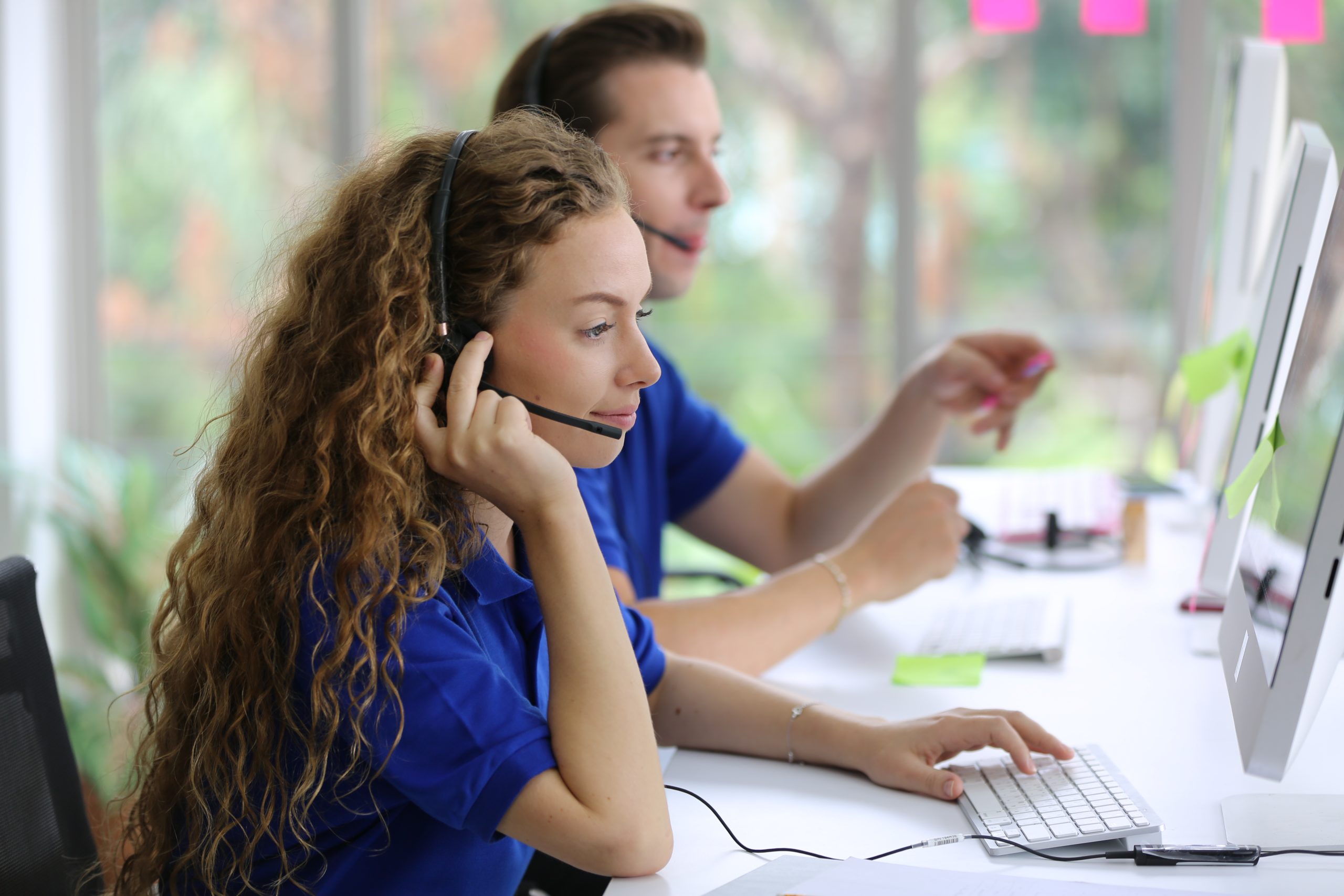 smiling woman in headset technical support